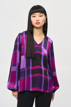 Load image into Gallery viewer, The essence of contemporary style, this satin top carries undeniable charm. The design features an alluring abstract plaid print that highlights your flair for great fashion. The long, puffed sleeves with elastic cuffs add a dramatic touch while the boxy silhouette offers both a comfortable, yet chic feel. The V-shaped neckline boasts a sleek shirt collar accentuating the garment’s poised look.