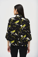 Load image into Gallery viewer, Unveil your bold flair for style with this sweater knit jacket. The trapeze silhouette sways beautifully while its chic abstract print and three-quarter sleeves with tulip cuffs exude an air of unique sophistication. The stand collar elevates the garment’s refined look as the statement front button closure and back yoke with panels add the perfect finishing touch to this stunning modern design.