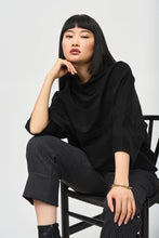 Load image into Gallery viewer, With a luxurious sweater knit fabric, cozy mock neck, and elegant bell sleeves, this pullover is guaranteed to create an exceptional look all while keeping you delightfully warm. Subtle stitching and JR metallic trim add to its charm.