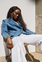 Load image into Gallery viewer, Cut from a stretch denim fabric, this double-breasted blazer offers an unexpected blend of structure and casual style that's next level. Designed with a classic lapel collar, faux-pocket flaps, and military-inspired buttons, you're sure to feel relaxed yet confidently put together.