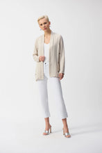 Load image into Gallery viewer, Inject an air of casual elegance to any attire with this sleek Joseph Ribkoff cover-up. The gauze garment features a chic neckband and long sleeves that create a polished look. The insert band with decorative buttons adds a bit more flair to this lovely wardrobe essential. 