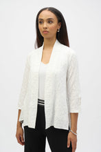 Load image into Gallery viewer, Infuse casual elegance into your everyday look with this beautiful Joseph Ribkoff cover-up. Crafted in textured jacquard fabric, the piece showcases three-quarter sleeves tailored with sleek slits, lending a refined appeal. The elongated hem at the sides elevates the garment’s straight silhouette while the side pockets add style and function to this classic wardrobe staple.