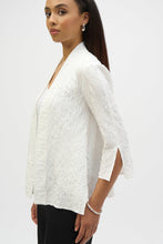 Load image into Gallery viewer, Infuse casual elegance into your everyday look with this beautiful Joseph Ribkoff cover-up. Crafted in textured jacquard fabric, the piece showcases three-quarter sleeves tailored with sleek slits, lending a refined appeal. The elongated hem at the sides elevates the garment’s straight silhouette while the side pockets add style and function to this classic wardrobe staple.