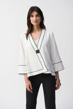 Load image into Gallery viewer, This Joseph Ribkoff jacket highlights flawless style and undeniable poise. Crafted in a jacquard fabric, the garment presents a chic swing silhouette with a charming front button closure creating a beautiful V-shaped neckline when secured. The three-quarter cuffed sleeves lend a bold look to this remarkable contemporary piece.