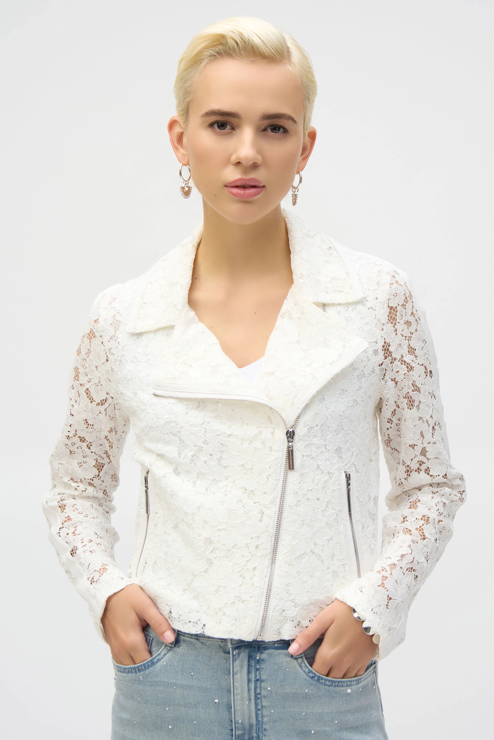 Channel your inner romantic rebel with this stunning Joseph Ribkoff lace moto jacket. Blending edgy vibes with delicate details, it’s the best of both worlds. Featuring a notched collar and zippered front, this jacket is as functional as it is fashionable. Lined for comfort, it’s the perfect piece to give your wardrobe a bold, stylish upgrade.