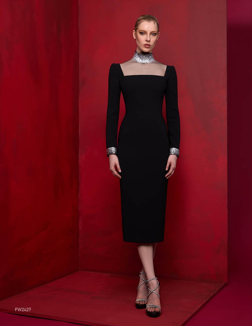 Stunning Lucian Matis tea-length evening gown with long sleeves and beautiful stone trim.