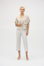 Load image into Gallery viewer, The definition of sporty chic, this Joseph Ribkoff hooded nylon jacket adds a trendy edge to your look. Featuring unexpected short dolman sleeves, front flap pockets, and a front zipper closure, it’s designed with a pleated back hem for added flair. An adjustable bungee cord lets you customize the relaxed fit to your liking.