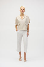 Load image into Gallery viewer, The definition of sporty chic, this Joseph Ribkoff hooded nylon jacket adds a trendy edge to your look. Featuring unexpected short dolman sleeves, front flap pockets, and a front zipper closure, it’s designed with a pleated back hem for added flair. An adjustable bungee cord lets you customize the relaxed fit to your liking.