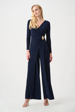 Load image into Gallery viewer, Silky Knit Wide Leg Wrap Jumpsuit
This wide-leg jumpsuit in silky knit features a wrap-style neckline and long straight sleeves for a refined silhouette. An overlapped leg on one side is accente…