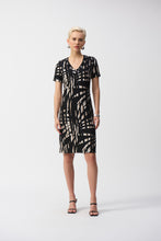 Load image into Gallery viewer, This shift dress gives off subtle island vibes with its tropical print and easygoing silhouette. Crafted from a lightweight silky knit that falls at the knees, it offers a flattering v-neckline with eyelet detailing, and short straight sleeves, making it a perfect summer-ready look.