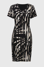 Load image into Gallery viewer, This shift dress gives off subtle island vibes with its tropical print and easygoing silhouette. Crafted from a lightweight silky knit that falls at the knees, it offers a flattering v-neckline with eyelet detailing, and short straight sleeves, making it a perfect summer-ready look.