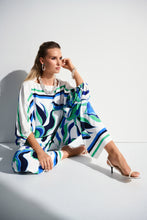 Load image into Gallery viewer, The pinnacle of contemporary glamour. These stunning woven pull-on pants will rival any piece in your wardrobe with their alluring abstract print. The wide-leg silhouette exudes timeless appeal and adds poise to every step. Sleek stripes at the hem elevate the design’s polished feel and unique look.
