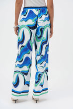 Load image into Gallery viewer, The pinnacle of contemporary glamour. These stunning woven pull-on pants will rival any piece in your wardrobe with their alluring abstract print. The wide-leg silhouette exudes timeless appeal and adds poise to every step. Sleek stripes at the hem elevate the design’s polished feel and unique look.