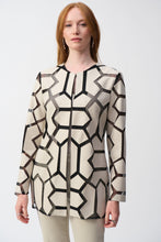 Load image into Gallery viewer, Indulge in the irresistible charm of this laser-cut mesh jacket. It is a modern work of art made from premium leatherette that blends futuristic style with refined sophistication. The jacket flaunts a hook-and-eye front closure, emphasizing its contemporary aesthetic.
