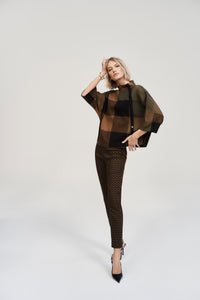 We all need a little plaid in our wardrobe. This cozy jacquard sweater knit top features a striking three-tone plaid pattern that's just as extraordinary as its design. A loose-fitting funnel neck adorned with decorative buttons on the side, along with three-quarter bell sleeves and a roomy fit give this piece an endlessly attractive appeal.