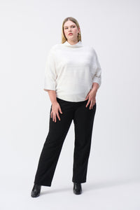 With a luxurious sweater knit fabric, cozy mock neck, and elegant bell sleeves, this pullover is guaranteed to create an exceptional look all while keeping you delightfully warm. Subtle stitching and JR metallic trim add to its charm.