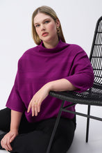 Load image into Gallery viewer, With a luxurious sweater knit fabric, cozy mock neck, and elegant bell sleeves, this pullover is guaranteed to create an exceptional look all while keeping you delightfully warm. Subtle stitching and JR metallic trim add to its charm.
