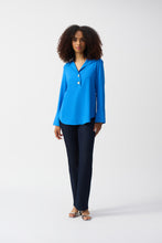 Load image into Gallery viewer, Indulge in the casual elegance of this lovely gauze top. The piece is tailored in a polished straight silhouette with a sleek shirt collar and front buttons, a classic, yet versatile look that can effortlessly transition from morning meetings to evening cocktails. The three-quarter sleeves with folded cuffs add character to this modern-style staple.
