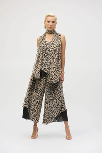 This chiffon tunic boasts a captivating animal print that exudes undeniable glamour. The piece features a sleeveless A-line silhouette and a chic scoop neckline, lending a sophisticated feel with timeless appeal. The garment’s reversible design and detachable scarf with fringe at the hem allow you to transform your look to suit any occasion. 
