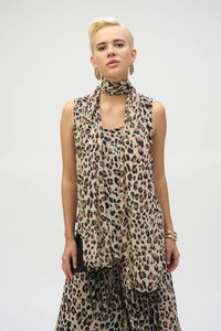 This chiffon tunic boasts a captivating animal print that exudes undeniable glamour. The piece features a sleeveless A-line silhouette and a chic scoop neckline, lending a sophisticated feel with timeless appeal. The garment’s reversible design and detachable scarf with fringe at the hem allow you to transform your look to suit any occasion. 
