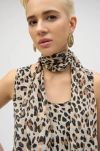 Load image into Gallery viewer, This chiffon tunic boasts a captivating animal print that exudes undeniable glamour. The piece features a sleeveless A-line silhouette and a chic scoop neckline, lending a sophisticated feel with timeless appeal. The garment’s reversible design and detachable scarf with fringe at the hem allow you to transform your look to suit any occasion. 
