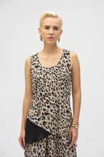 Load image into Gallery viewer, This chiffon tunic boasts a captivating animal print that exudes undeniable glamour. The piece features a sleeveless A-line silhouette and a chic scoop neckline, lending a sophisticated feel with timeless appeal. The garment’s reversible design and detachable scarf with fringe at the hem allow you to transform your look to suit any occasion. 

