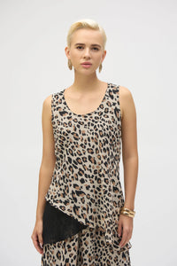 This chiffon tunic boasts a captivating animal print that exudes undeniable glamour. The piece features a sleeveless A-line silhouette and a chic scoop neckline, lending a sophisticated feel with timeless appeal. The garment’s reversible design and detachable scarf with fringe at the hem allow you to transform your look to suit any occasion. 
