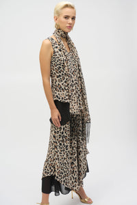 This chiffon tunic boasts a captivating animal print that exudes undeniable glamour. The piece features a sleeveless A-line silhouette and a chic scoop neckline, lending a sophisticated feel with timeless appeal. The garment’s reversible design and detachable scarf with fringe at the hem allow you to transform your look to suit any occasion. 