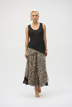 Load image into Gallery viewer, This chiffon tunic boasts a captivating animal print that exudes undeniable glamour. The piece features a sleeveless A-line silhouette and a chic scoop neckline, lending a sophisticated feel with timeless appeal. The garment’s reversible design and detachable scarf with fringe at the hem allow you to transform your look to suit any occasion. 
