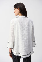 Load image into Gallery viewer, This Joseph Ribkoff jacket highlights flawless style and undeniable poise. Crafted in a jacquard fabric, the garment presents a chic swing silhouette with a charming front button closure creating a beautiful V-shaped neckline when secured. The three-quarter cuffed sleeves lend a bold look to this remarkable contemporary piece.
