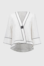 Load image into Gallery viewer, This Joseph Ribkoff jacket highlights flawless style and undeniable poise. Crafted in a jacquard fabric, the garment presents a chic swing silhouette with a charming front button closure creating a beautiful V-shaped neckline when secured. The three-quarter cuffed sleeves lend a bold look to this remarkable contemporary piece.
