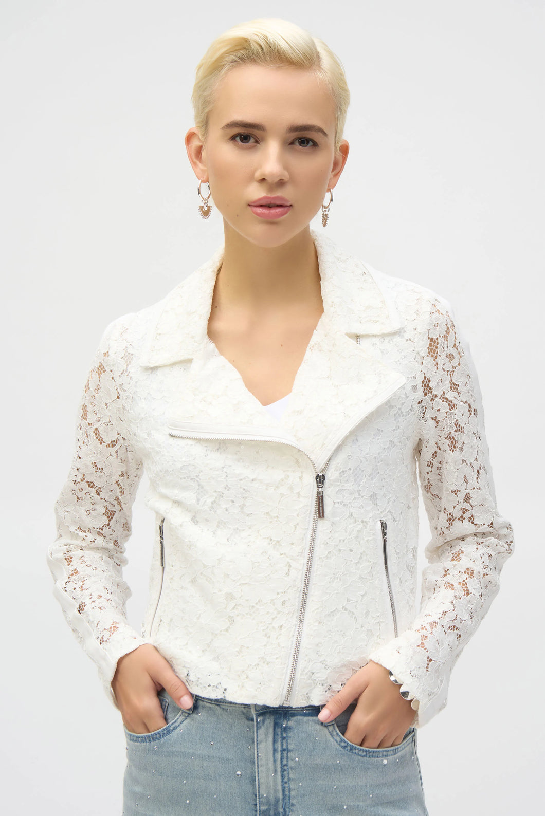 Channel your inner romantic rebel with this stunning Joseph Ribkoff lace moto jacket. Blending edgy vibes with delicate details, it’s the best of both worlds. Featuring a notched collar and zippered front, this jacket is as functional as it is fashionable. Lined for comfort, it’s the perfect piece to give your wardrobe a bold, stylish upgrade.