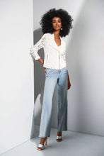 Load image into Gallery viewer, Channel your inner romantic rebel with this stunning Joseph Ribkoff lace moto jacket. Blending edgy vibes with delicate details, it’s the best of both worlds. Featuring a notched collar and zippered front, this jacket is as functional as it is fashionable. Lined for comfort, it’s the perfect piece to give your wardrobe a bold, stylish upgrade.

