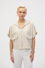 Load image into Gallery viewer, The definition of sporty chic, this Joseph Ribkoff hooded nylon jacket adds a trendy edge to your look. Featuring unexpected short dolman sleeves, front flap pockets, and a front zipper closure, it’s designed with a pleated back hem for added flair. An adjustable bungee cord lets you customize the relaxed fit to your liking.
