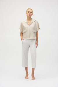 The definition of sporty chic, this Joseph Ribkoff hooded nylon jacket adds a trendy edge to your look. Featuring unexpected short dolman sleeves, front flap pockets, and a front zipper closure, it’s designed with a pleated back hem for added flair. An adjustable bungee cord lets you customize the relaxed fit to your liking.
