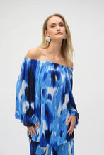 Load image into Gallery viewer, With its alluring off-shoulder neckline and striking tropical print, this Joseph Ribkoff flared top is pure vacation vibes; all that&#39;s missing is a mocktail. Three-quarter bell sleeves enhance its relaxed charm, while the pleated novelty fabric adds a subtle touch of texture.

