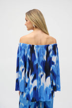 Load image into Gallery viewer, With its alluring off-shoulder neckline and striking tropical print, this Joseph Ribkoff flared top is pure vacation vibes; all that&#39;s missing is a mocktail. Three-quarter bell sleeves enhance its relaxed charm, while the pleated novelty fabric adds a subtle touch of texture.
