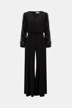 Load image into Gallery viewer, Silky Knit Wide Leg Wrap Jumpsuit

This wide-leg jumpsuit in silky knit features a wrap-style neckline and long straight sleeves for a refined silhouette. An overlapped leg on one side is accente…
