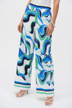 Load image into Gallery viewer, The pinnacle of contemporary glamour. These stunning woven pull-on pants will rival any piece in your wardrobe with their alluring abstract print. The wide-leg silhouette exudes timeless appeal and adds poise to every step. Sleek stripes at the hem elevate the design’s polished feel and unique look.

