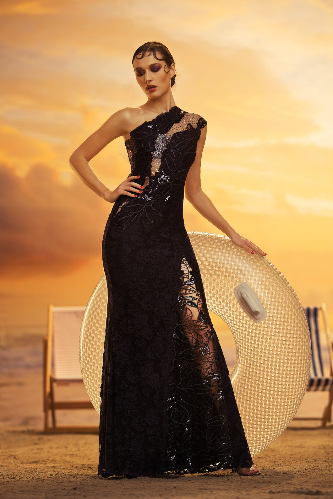 Stunning one-shoulder floor-length gown in lace with sheer insets in black.